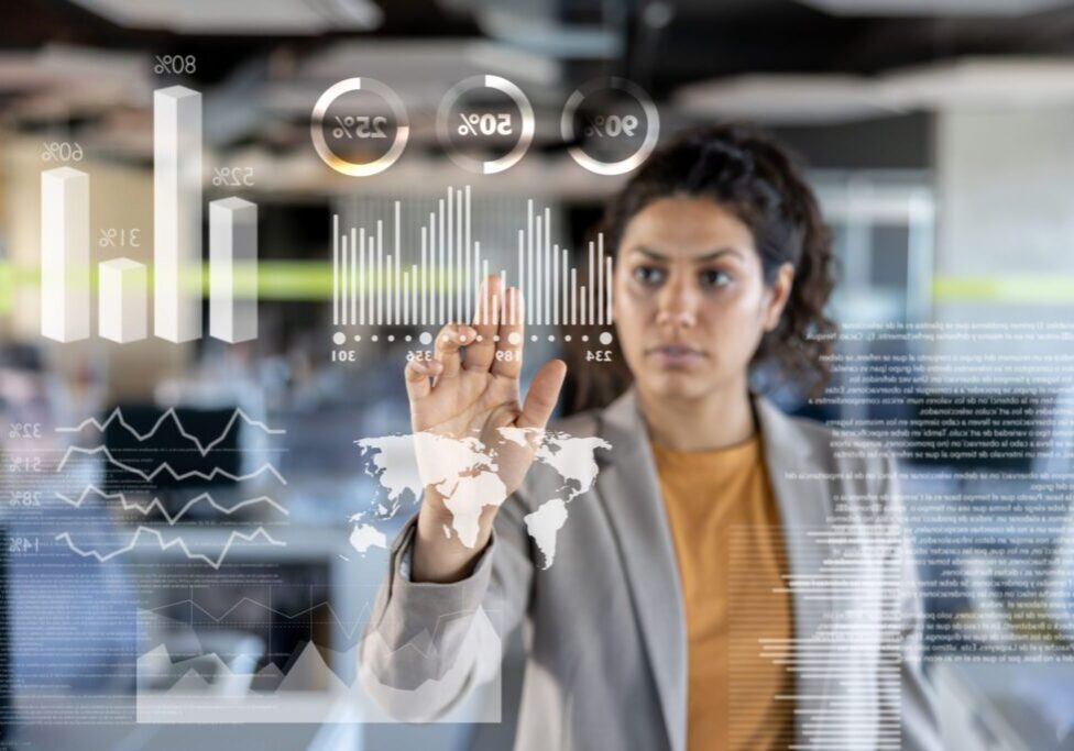 Woman interacting with digital data interface.